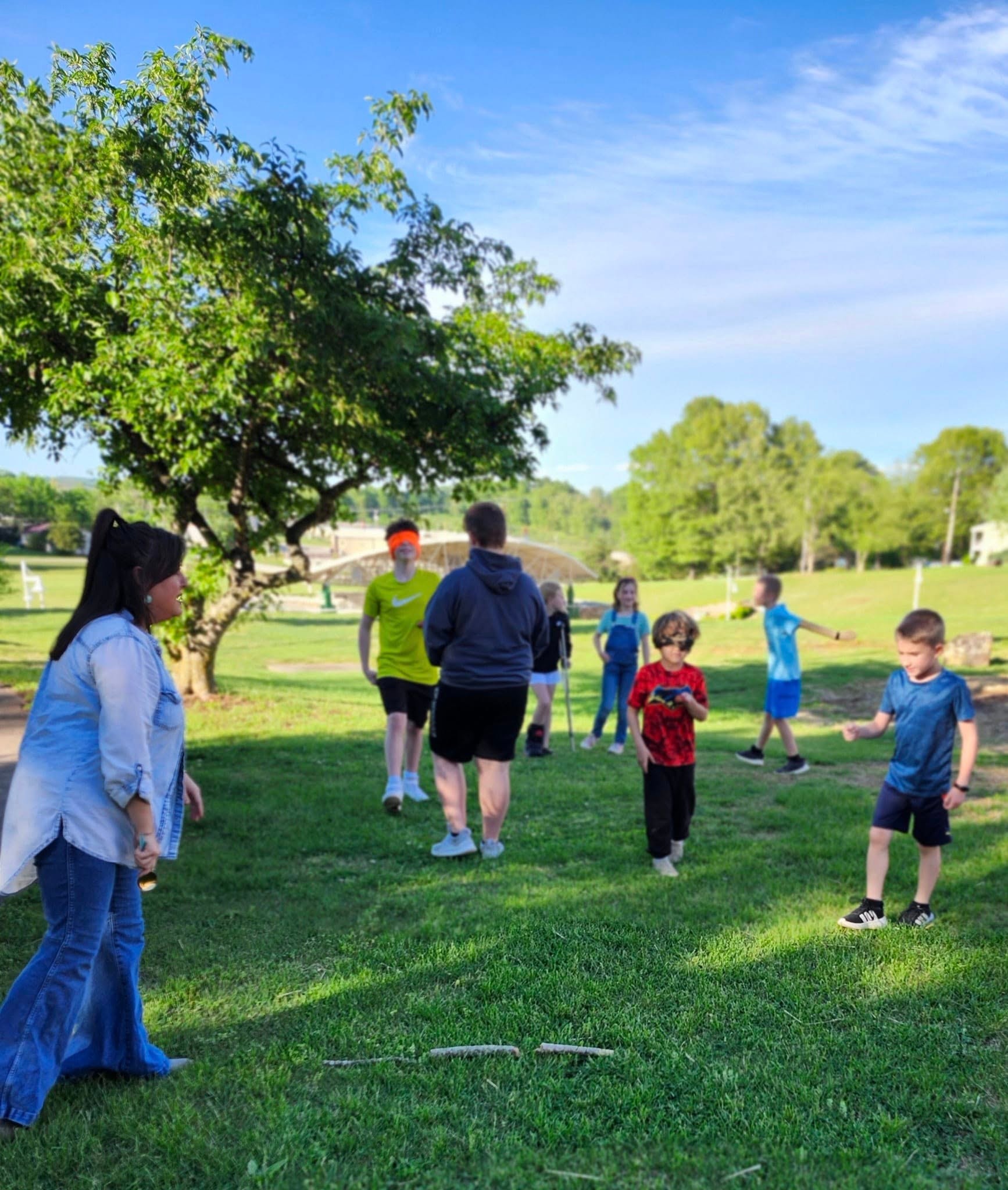 Students playing an outdoor confidence-building game at the park